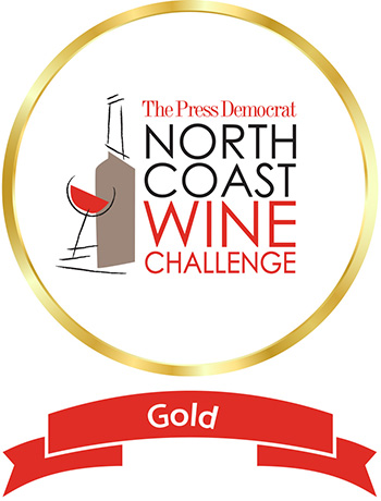 Gold circle on white background, text reads The Press Democrat North Coast Wine Challenge, gold