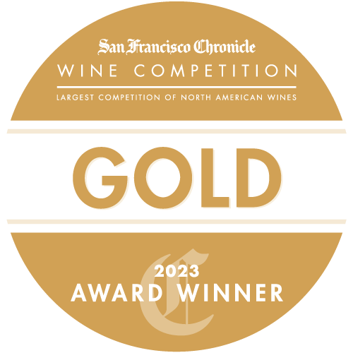 Gold circle with gold and white text: GOLD medal 2023 SF Chronicle Wine Competition