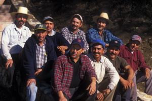 Hendry's vineyard and winery crew seated in two rows. Lots of hats, lots of mustaches.